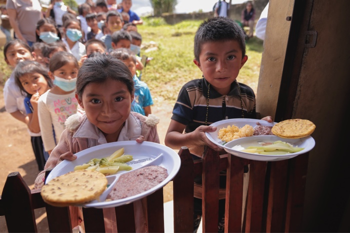 Children with plates of food