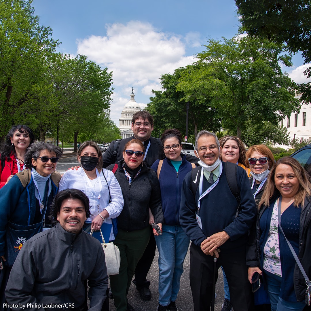 Group posing together in front of US Congress building.
